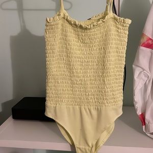 yellow body suit size small